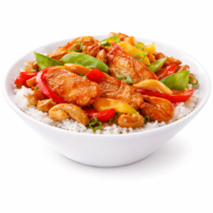 Un bol de POULET AIGRE DOUX (250g/pers) rempli de riz, de poulet sauté, de poivrons, de pois mange-tout, de noix de cajou et d'oignons verts colorés.
