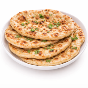 Un NAN ROTI (Pièce), doré et garni d'herbes vertes fraîches, est servi dans un bol blanc sur fond blanc.