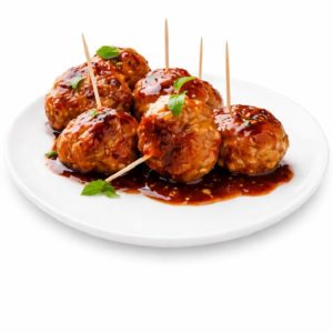 BOULETTES DE POULET SUCRÉES PIQUANTES (250g/pers) servies sur une assiette blanche : six boulettes de viande glacées nappées de sauce, garnies d'herbes vertes fraîches et munies chacune d'un cure-dent pour faciliter le service.