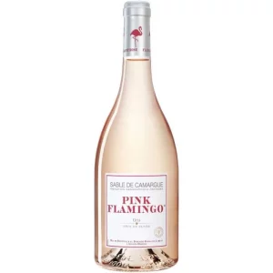 La bouteille de 75cl de VIN ROSÉ PINK FLAMINGO présente une teinte rose pâle, l'étiquette Sable de Camargue Pink Flamingo Gris Tête de Cuvée, et un logo de flamant rose sur le col.
